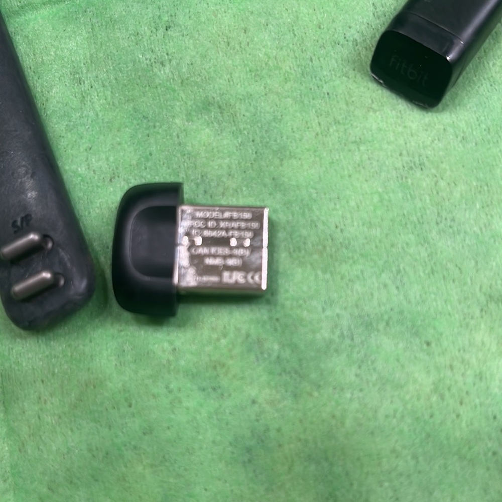 Fitbit Purchased but used twice Cleaning things out so my loss is your gain. SM - Picture 2 of 4